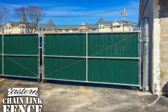 6 Foot High and 1 Foot Barb Wire Galvanized Fabric and Framework with Mid-Rail and Green Wing Slats